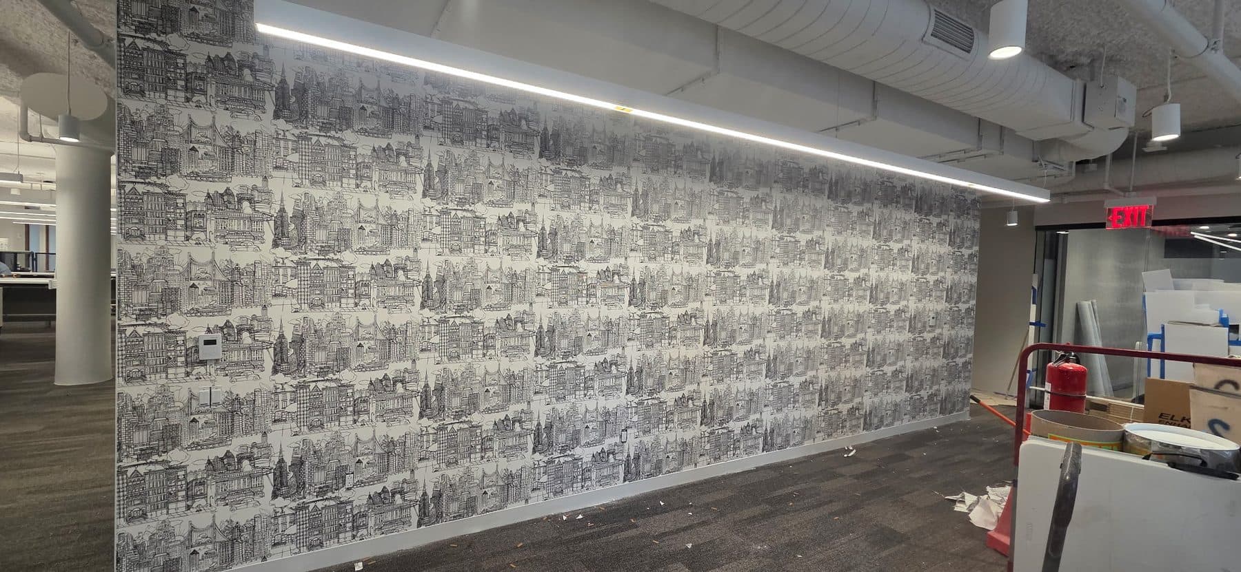 Photographic collage wallcovering down a long corridor