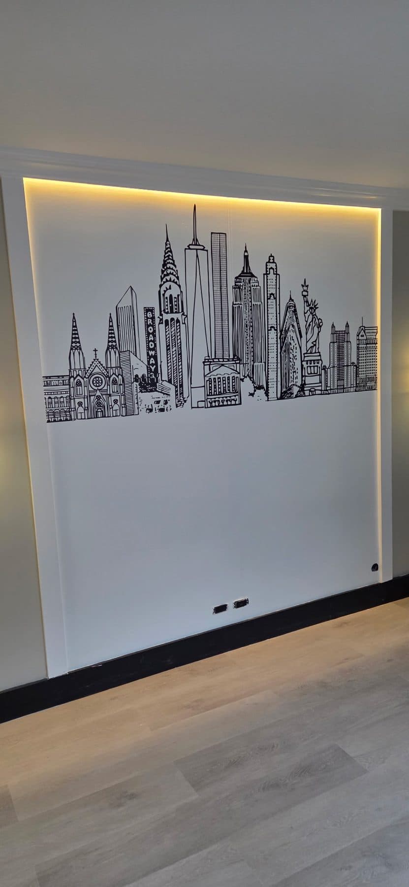Line-drawn skyline on a backlit feature wall