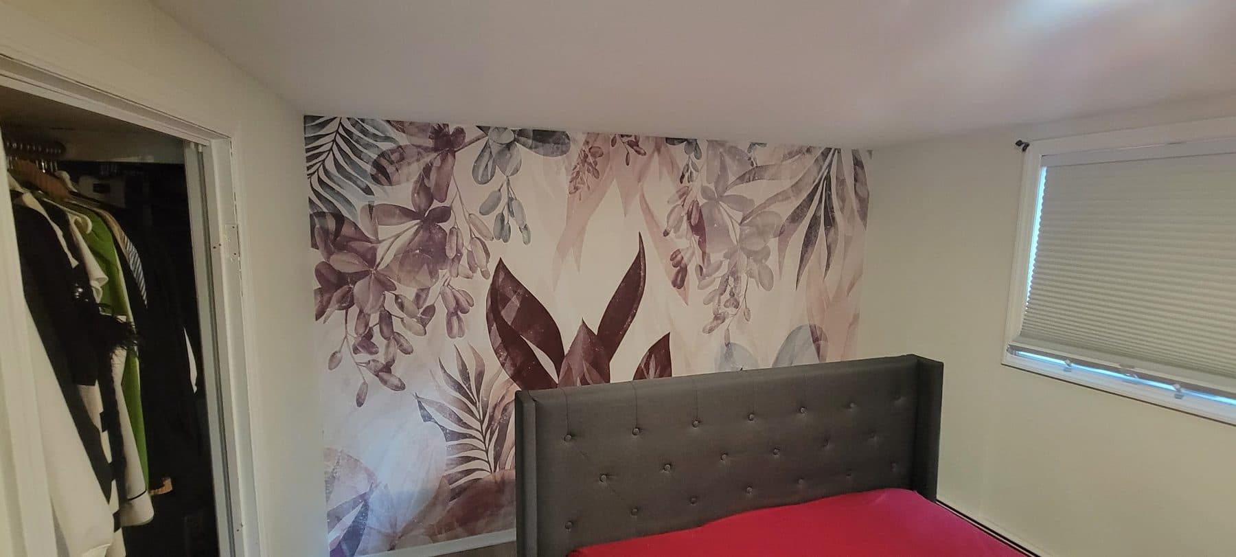 Botanical mural behind the bed
